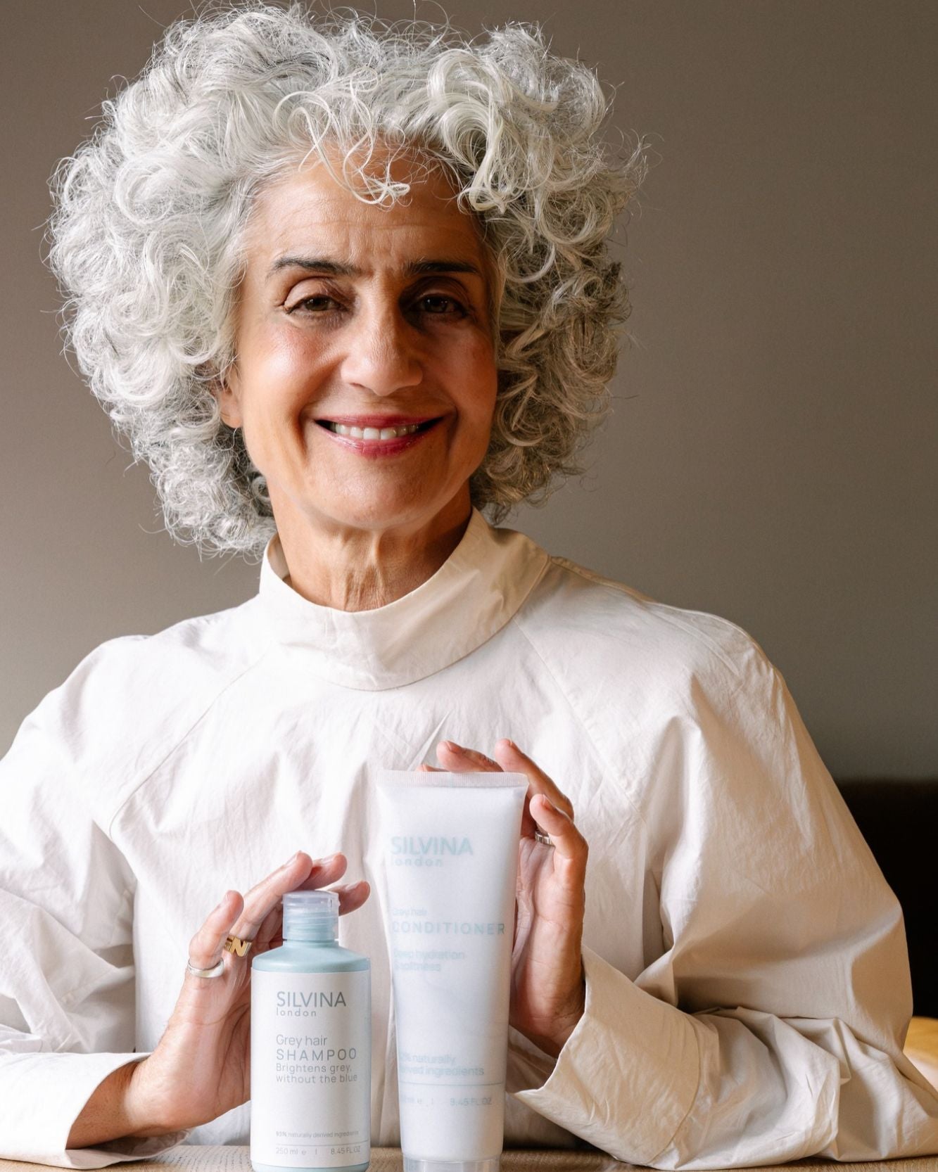 Silvina with bright silver hair and the Grey Hair Shampoo